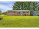 Charming brick home with a lush front yard, inviting curb appeal, and a well-kept lawn at 207 Mcleod Dr, Sanford, NC 27330