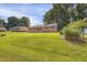 Home exterior displaying expansive front lawn and charming curb appeal with brick facade at 207 Mcleod Dr, Sanford, NC 27330
