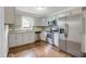 Well-appointed kitchen with stainless steel appliances and stone backsplash at 207 Mcleod Dr, Sanford, NC 27330