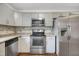Updated kitchen with stainless steel appliances and stylish granite countertops at 207 Mcleod Dr, Sanford, NC 27330