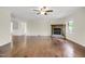 Spacious living room featuring hardwood floors and a cozy fireplace at 207 Mcleod Dr, Sanford, NC 27330