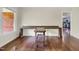 Hardwood floors throughout the living room with a built-in desk and large window views at 207 Mcleod Dr, Sanford, NC 27330