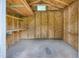 Inside the shed, find ample storage with built-in shelving and a bright interior at 207 Mcleod Dr, Sanford, NC 27330