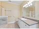 Bathroom featuring a vanity with gray countertop and tiled floors at 207 N Hopkins Ave, Spring Hope, NC 27882