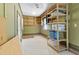 Garage with ample storage and shelves, perfect for organization at 207 N Hopkins Ave, Spring Hope, NC 27882