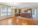 Open kitchen with wood cabinets, stainless steel appliances, and modern lighting fixtures at 207 N Hopkins Ave, Spring Hope, NC 27882