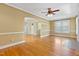 Cozy living room with hardwood flooring, a fireplace, and plenty of natural light at 207 N Hopkins Ave, Spring Hope, NC 27882