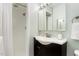 Bathroom featuring a single sink vanity, shower, and neutral color palette at 241 E Cornwall Rd, Cary, NC 27511