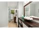 Bathroom featuring a single sink vanity, shower, and neutral color palette at 241 E Cornwall Rd, Cary, NC 27511