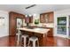 Kitchen with wooden cabinets, stainless steel appliances, granite countertops, and a large island at 241 E Cornwall Rd, Cary, NC 27511