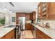 Spacious kitchen featuring wooden cabinets, stainless steel appliances, and granite countertops at 241 E Cornwall Rd, Cary, NC 27511