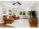 Well-lit living room featuring hardwood floors, neutral paint, and a large window for natural light at 241 E Cornwall Rd, Cary, NC 27511