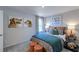 Cozy bedroom with accent art over the bed and whimsical dog-themed art at 241 Tidal Pool Way, Cary, NC 27519