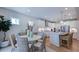Inviting kitchen with a central island, stainless steel appliances, and adjacent dining area at 241 Tidal Pool Way, Cary, NC 27519