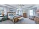 This primary bedroom offers a ceiling fan and is brightly illuminated by natural light at 241 Tidal Pool Way, Cary, NC 27519