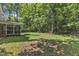 Lush backyard with a screened-in porch, offering a serene and private outdoor space at 2513 Myrtle Ln, Hillsborough, NC 27278