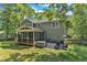 Expansive backyard with a screened porch, patio, and ample space for outdoor activities and relaxation at 2513 Myrtle Ln, Hillsborough, NC 27278