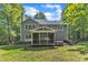 Beautiful backyard showcasing a screened porch, hot tub, and patio area perfect for outdoor entertaining at 2513 Myrtle Ln, Hillsborough, NC 27278