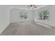 Spacious bedroom with vaulted ceiling and large windows providing ample natural light at 2513 Myrtle Ln, Hillsborough, NC 27278