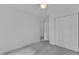 Light, bright bedroom features gray carpet and white walls with access to other rooms at 2513 Myrtle Ln, Hillsborough, NC 27278