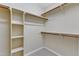 Walk-in closet with built-in shelving and rod for organized storage at 2513 Myrtle Ln, Hillsborough, NC 27278