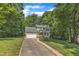 Charming two-story home featuring an attached two-car garage, well-manicured landscaping, and a welcoming front porch at 2513 Myrtle Ln, Hillsborough, NC 27278