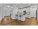 Kitchen featuring a breakfast bar, light colored cabinetry and light fixtures at 2513 Myrtle Ln, Hillsborough, NC 27278