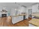 Open floor plan kitchen featuring a breakfast bar, stainless steel appliances and fireplace at 2513 Myrtle Ln, Hillsborough, NC 27278