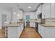 Kitchen featuring a breakfast bar, stainless steel appliances and light fixtures at 2513 Myrtle Ln, Hillsborough, NC 27278