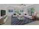 Staged living room with stylish furnishings, neutral walls, and great natural light at 2513 Myrtle Ln, Hillsborough, NC 27278