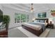 Spacious main bedroom with a tray ceiling and a large window offering natural light at 2513 Myrtle Ln, Hillsborough, NC 27278