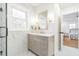 Stylish bathroom with marble accents, modern fixtures, and a large window for natural light at 2515 W Club Blvd, Durham, NC 27705