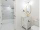 Bathroom featuring a vanity with an oval mirror and a shower/tub combination beyond the doorway at 2515 W Club Blvd, Durham, NC 27705