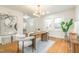 Dining room featuring modern decor, stylish table setting, and bright natural light from the window at 2515 W Club Blvd, Durham, NC 27705
