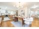 Dining area blends into a modern kitchen, featuring stainless steel appliances and a center island at 2515 W Club Blvd, Durham, NC 27705