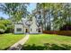 Inviting two-story home with manicured lawn, showcasing its classic design and curb appeal at 2515 W Club Blvd, Durham, NC 27705