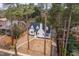 Charming renovated two-story house with white painted brick, manicured lawn, and mature trees at 2515 W Club Blvd, Durham, NC 27705