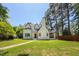 Charming two-story home with a manicured lawn and traditional architectural details at 2515 W Club Blvd, Durham, NC 27705