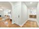 Inviting hallway with hardwood floors leading to the kitchen and living room at 2515 W Club Blvd, Durham, NC 27705
