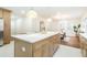 Bright kitchen featuring a large island with white countertop and stylish cabinetry at 2515 W Club Blvd, Durham, NC 27705