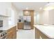 Modern kitchen featuring stainless steel refrigerator and stylish two-tone cabinetry at 2515 W Club Blvd, Durham, NC 27705
