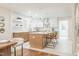 Bright kitchen with white cabinets, stainless appliances, and an island with bar seating at 2515 W Club Blvd, Durham, NC 27705