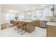 Open kitchen features modern appliances, large island with seating, and an adjacent dining area at 2515 W Club Blvd, Durham, NC 27705