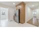 Modern kitchen featuring stainless steel refrigerator and stylish two-tone cabinetry at 2515 W Club Blvd, Durham, NC 27705
