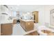 Bright kitchen featuring a large island, stainless appliances, and stylish cabinetry at 2515 W Club Blvd, Durham, NC 27705