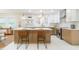 Modern kitchen boasts a large island, stainless appliances, and stylish two-tone cabinetry at 2515 W Club Blvd, Durham, NC 27705