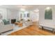 Open-concept living space with hardwood floors, fireplace, stylish seating, and unique design elements at 2515 W Club Blvd, Durham, NC 27705