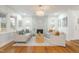 Inviting living room with large windows, a marble fireplace, and comfortable seating arrangement at 2515 W Club Blvd, Durham, NC 27705