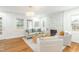 Bright living room with a modern fireplace, neutral-toned furniture, and large windows for ample light at 2515 W Club Blvd, Durham, NC 27705
