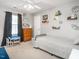 bedroom with a daybed, table with chairs, and decorative accents at 2605 Mcdougall Dr, Burlington, NC 27217